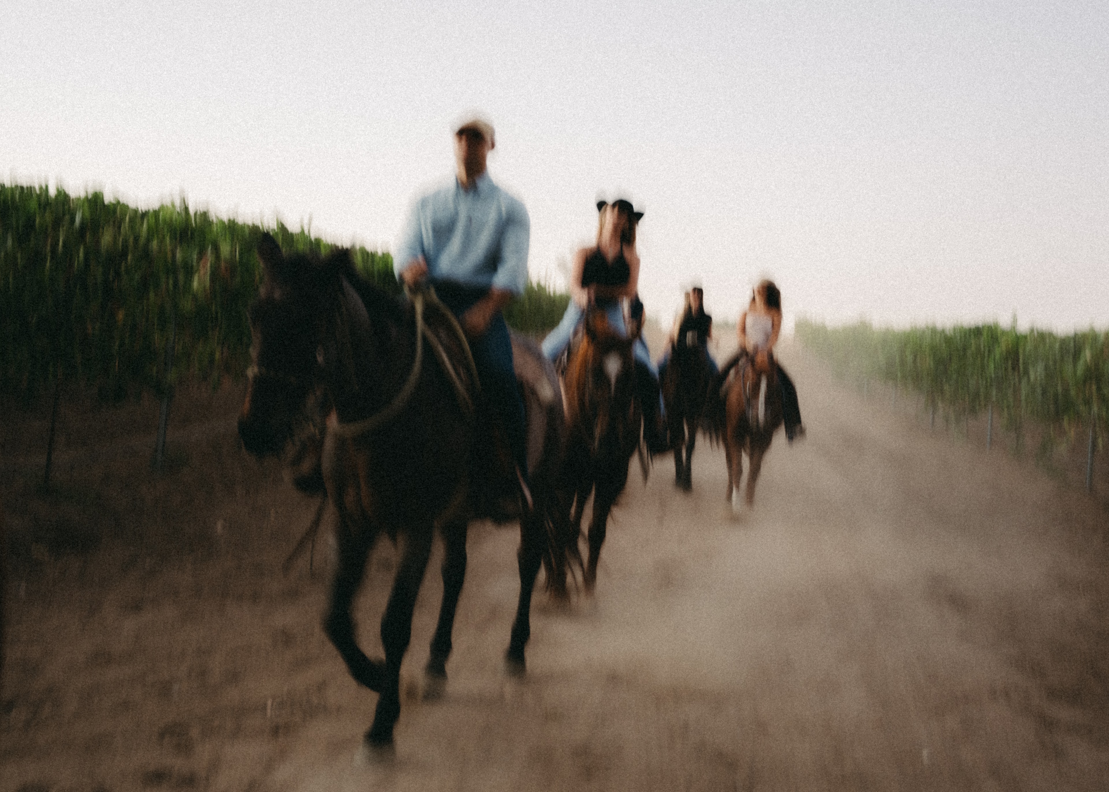 Cowboys bringing horses in at dusk